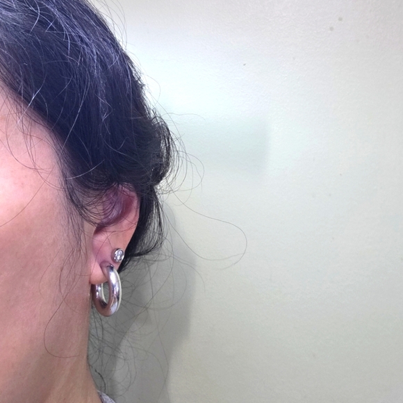 Silver toned puffy hoop huggie clip on retractable comfort Earrings - Picture 10 of 11